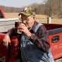Gordon Gilliland getting a drink from the Gilliland spring, English IN