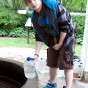 Young man getting water for his family, Flowing Well Park, Carmel IN